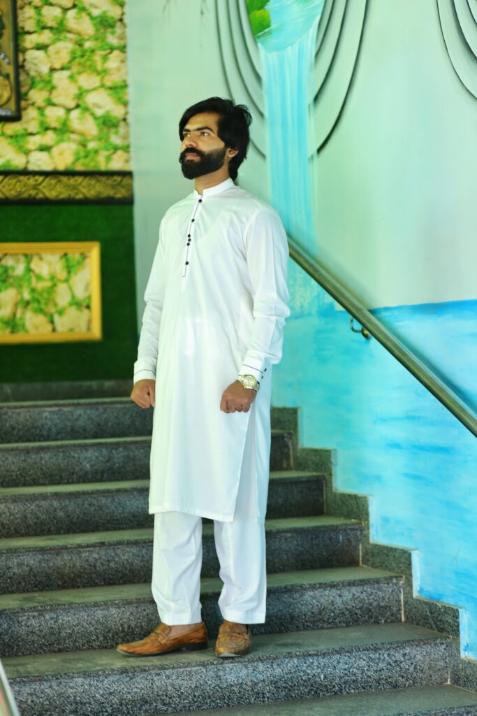 off white color modern style shalwar kameez with black & red yarn buttons & modern cuffs.